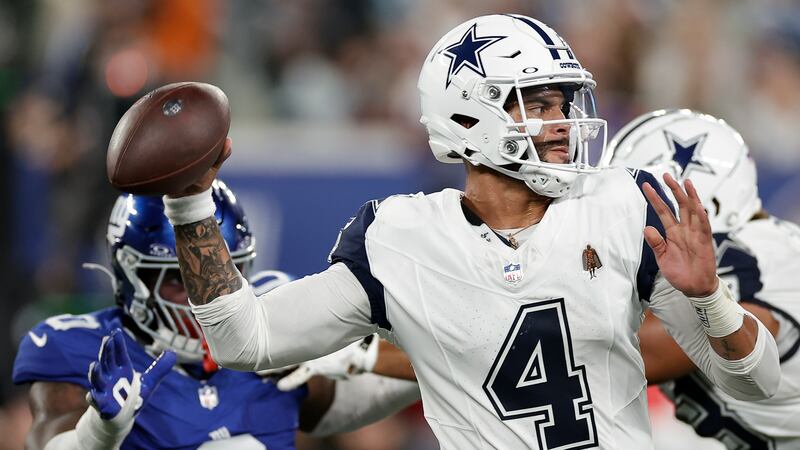Dak Prescott throwing a pass during the Cowboys-Raiders game