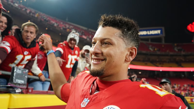 Kansas City Chiefs quarterback Patrick Mahomes smiles following an NFL football game against...