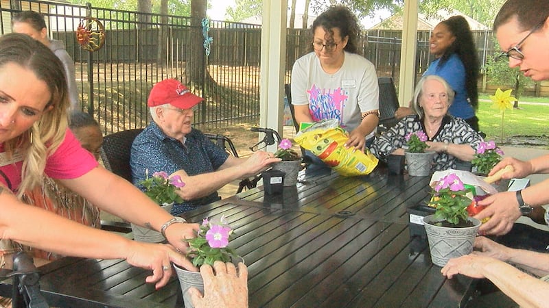 Arabella of Kilgore Senior Living, memory care residents spent the day planting flowers...