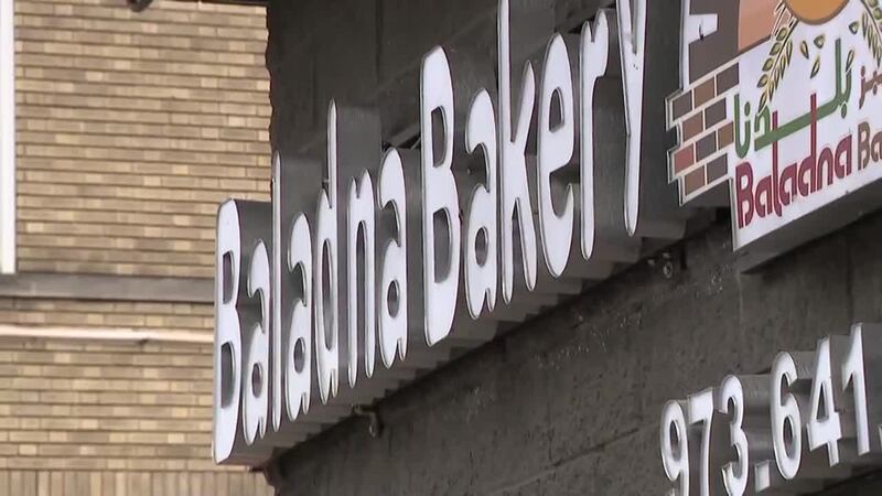 A customer allegedly stabbed a bakery owner over a sandwich he was sold four years ago.